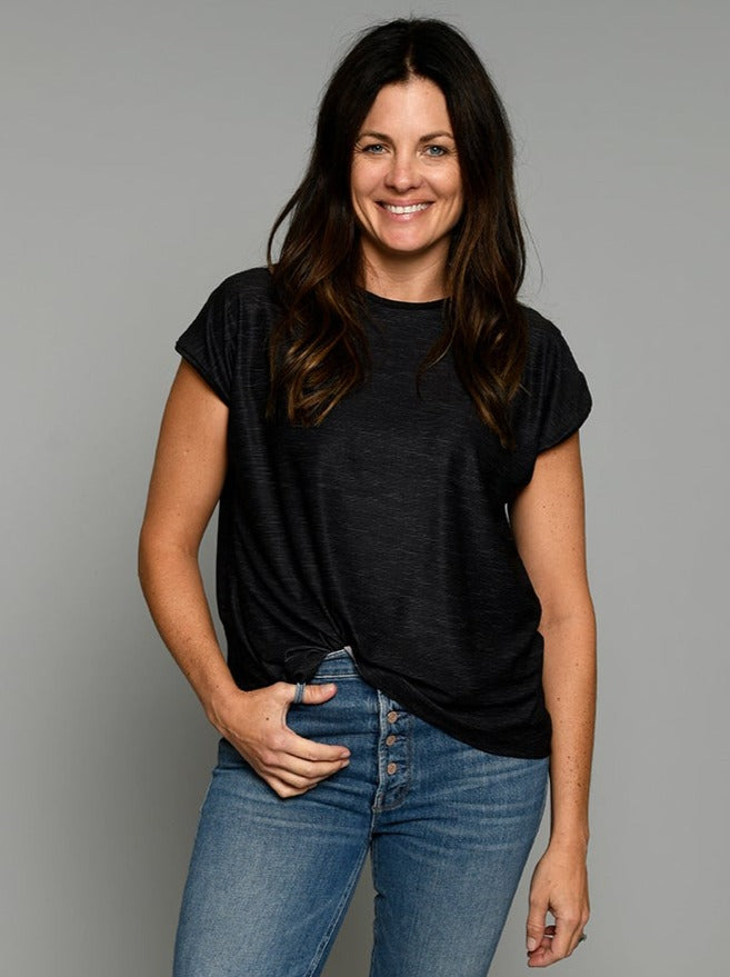 Flip Outfit Reversible Women’s Relaxed T Shirt, Top - solid black reverses to grey. Loose fit sweat-wicking UPF 50. Made in the USA from recycled plastic bottles. Made by women for women. Front view of black side.